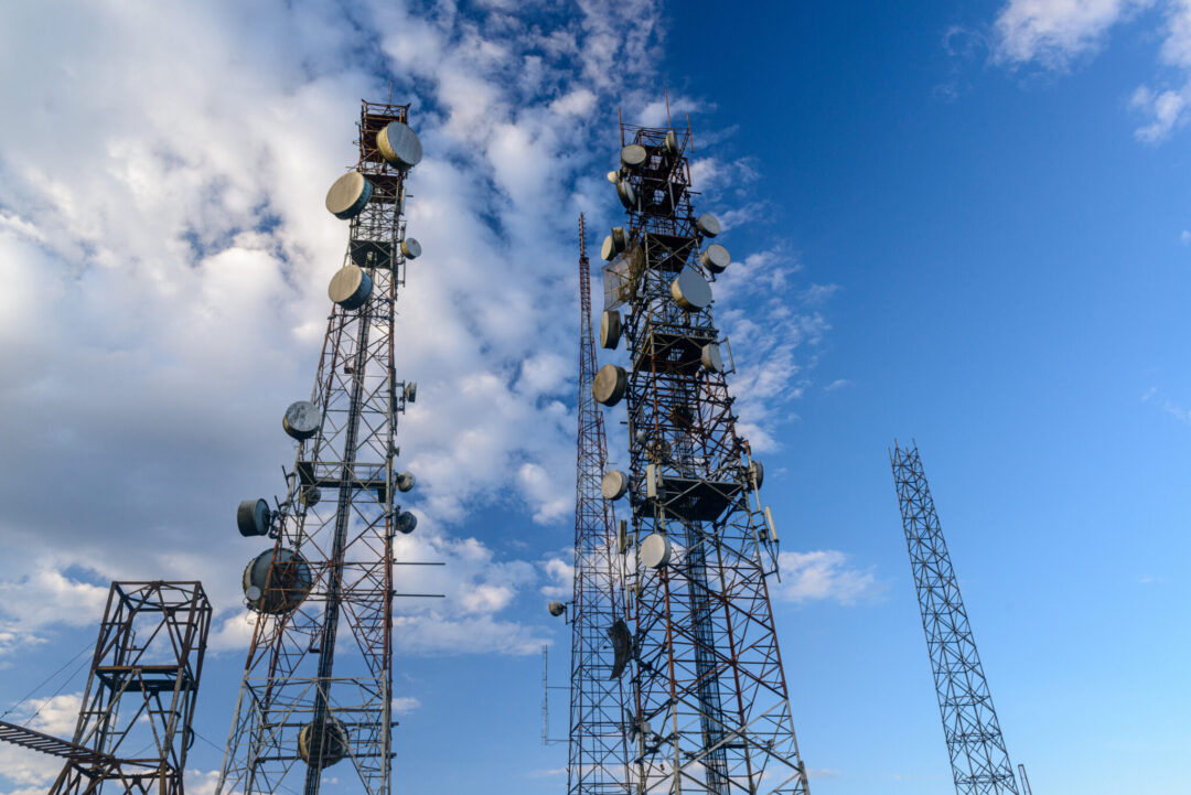 Telecommunications towers with blue skies and clouds in the background, at the Jabre peak in Matureia, Paraiba, Brazil on December 19, 2020.