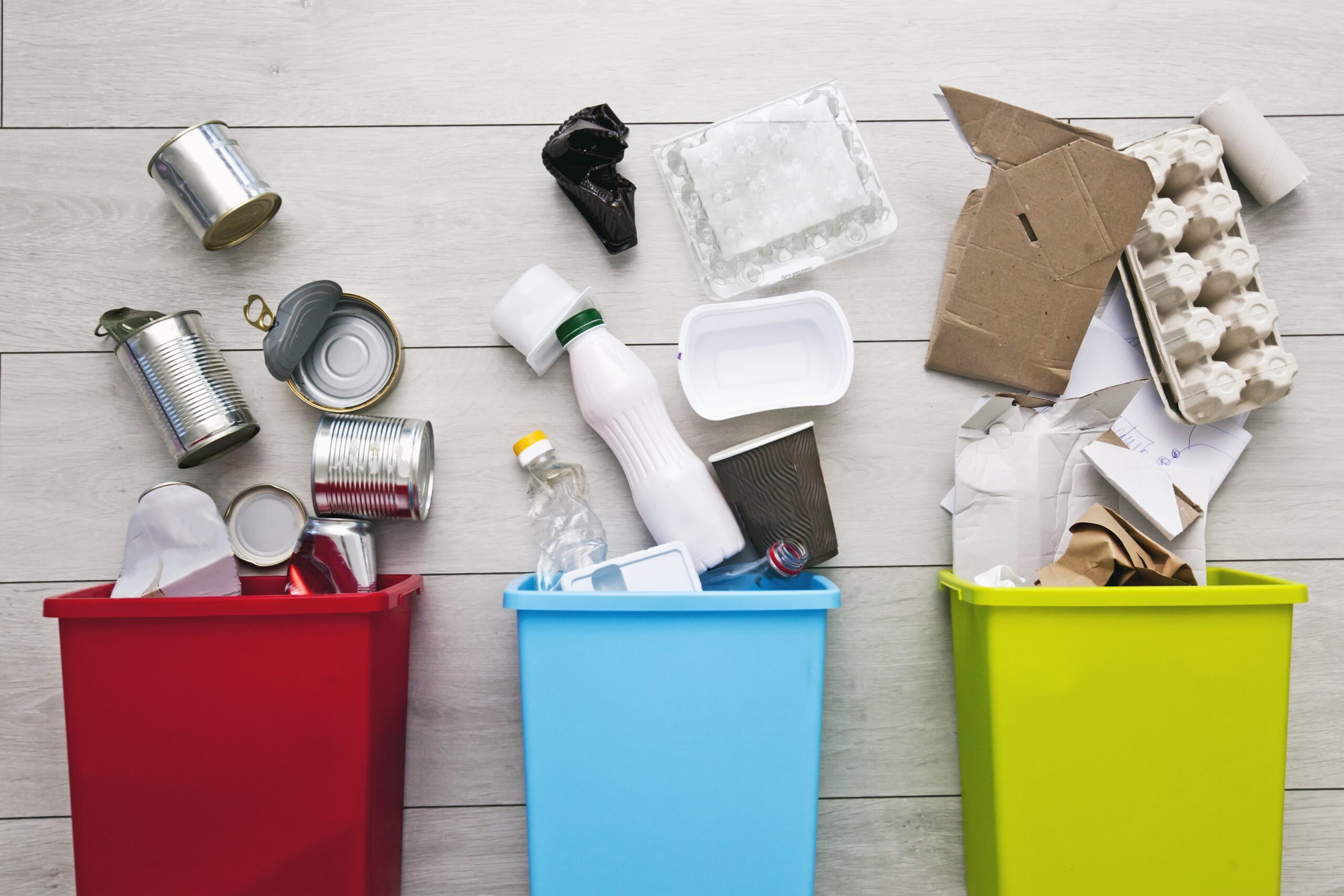 Three different container for sorting garbage. For plastic, paper, metal